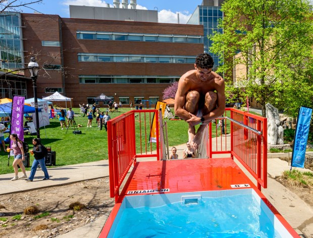 Lehigh University student John Deutsch jumps into cold water Friday, April 17, 2026, during Special Olympics Pennsylvania's Mobile Polar Plunge at Lehigh University in Bethlehem. More than 100 Lehigh students and staff jumped into the water to raise money and awareness for athletes with intellectual and developmental disabilities. (April Gamiz/The Morning Call)