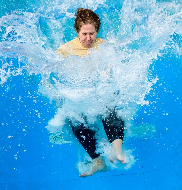 Lehigh University's Ashley Lemmons, assistant vice president and dean for student life and leadership, takes the plunge Friday, April 17, 2026, during Special Olympics Pennsylvania's Mobile Polar Plunge at Lehigh University in Bethlehem. More than 100 Lehigh students and staff jumped into the water to raise money and awareness for athletes with intellectual and developmental disabilities. (April Gamiz/The Morning Call)