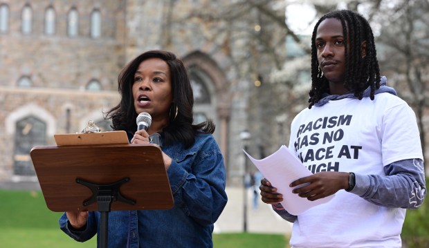 Lehigh University Professor Kashi Johnson, left, and Justin Burrell, president of Lehigh's Black Student Union, speak Monday, April 6, 2026, at a public demonstration against racism at the university in Bethlehem. Students say racist messages were drawn on two plastic jugs, known as BORGs, found on or near the campus in recent months, and they were calling on leadership to address it. (Monica Cabrera/The Morning Call)