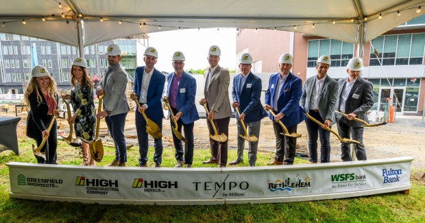 David Aungst, president of High Hotels Ltd. Bethlehem Mayor J. William Reynolds and others shovel dirt Tuesday, April 28, 2026, during a groundbreaking ceremony for the new Tempo by Hilton hotel. The 100-foot-tall, 141-room hotel marks a major investment in Bethlehem's SouthSide, and is scheduled to open in October 2027. (April Gamiz/The Morning Call)