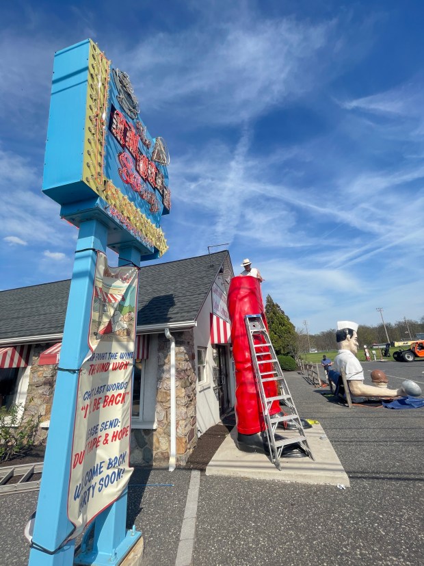 Roadside artist Mark Cline prepares the bottom half of the Giant Chip statue Thursday, April 16, 2026, at Inside Scoop in Coopersburg. The popular, 25-foot-high statue was toppled by high winds in February. Cline, who built the statue, was on site Thursday to repair it. (Monica Cabrera / The Morning Call)