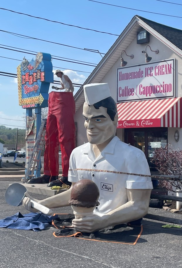 Roadside artist Mark Cline prepares the bottom half of the Giant Chip statue Thursday, April 16, 2026, at Inside Scoop in Coopersburg. The popular, 25-foot-high statue was toppled by high winds in February. Cline, who built the statue, was on site Thursday to repair it. (Monica Cabrera / The Morning Call)