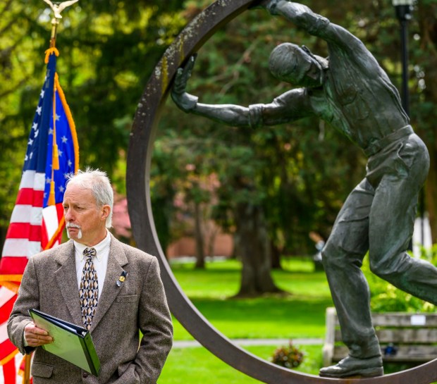 During the 35th annual Lehigh Valley Workers' Memorial Day ceremony Sunday, April 26, 2026, at the Bethlehem Rose Garden, Ron Ennis of the Lehigh Valley Labor Council speaks about one of the area's bloodiest workplace tragedies, when when two gunmen walked into the First National Bank of Bath and shot five people June 6, 1986, killing three immediately, and a fourth who died years later. Three names will be added this year to the Lehigh Valley Workers' Memorial list, which includes roughly 4,400 workplace facilities since before the Civil War. Added this year are April Lubenetski, 51, who died May 19, 2025, after suffering from occupational cancer as a result of her employment as an Emmaus and Lehigh Township volunteer firefighter; Steven Gill, 36, who died May 21, 2025, when he was hit by an excavator in Weisenberg Township; and James Akins, 57, who died July 29, 2025, after suffering a medical event while installing solar panels on a roof in Allen Township. (April Gamiz/The Morning Call)