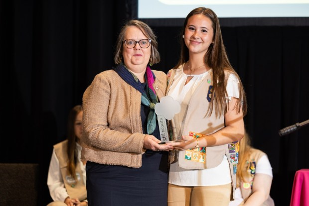 Dr. Karen Wang, Dr. Karen Wang, chief medical officer at Berks Community Health Center, accepts an award from Girl Scout Mackenzie R. at Girl Scouts of Eastern Pennsylvania's annual Take the Lead event. Mackenzie R. shadowed Wang for a day.(Courtesy of Girl Scouts of Eastern Pennsylvania.)