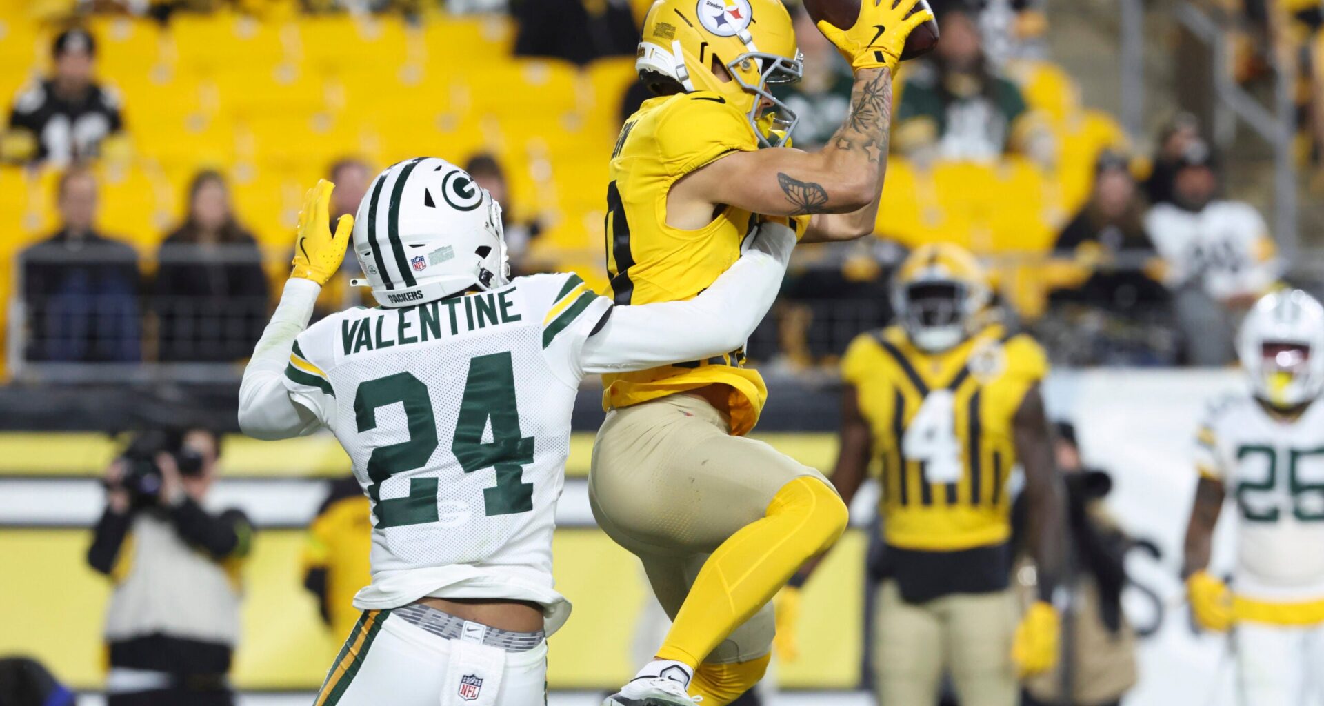 Oct 26, 2025; Pittsburgh, Pennsylvania, USA; Pittsburgh Steelers wide receiver Roman Wilson (10) attempts a catch against Green Bay Packers cornerback Carrington Valentine (24) during the fourth quarter at Acrisure Stadium.