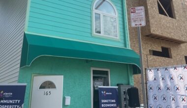 The teal home was developed in the first phase of nonprofit Xiente's Mi Casa project, which built 10 single-family rental homes for low-income families in the Norris Square neighborhood.