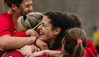 women sports players celebrating