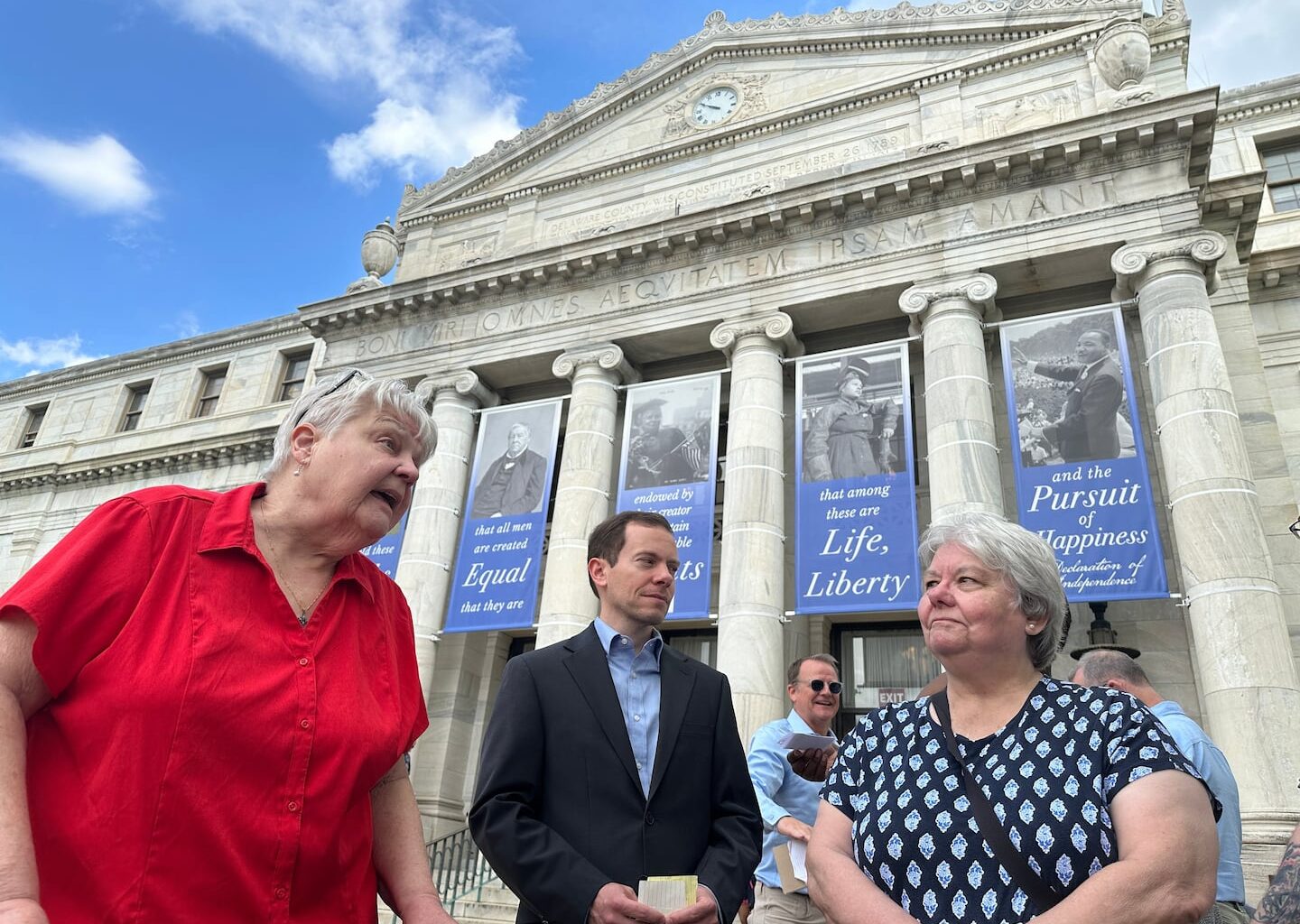 Judy Prichard McCleary (left) and Greg Prichard (center), whose relatives' burial sites were disturbed in a crime spree involving the theft of more than 100 bodies from Pennsylvania cemeteries, spoke with reporters outside the Delaware County Courthouse in Media, Pa., on Friday.