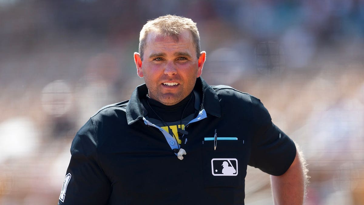 MLB umpire Brock Ballou standing on the field during a spring training game