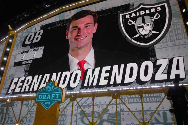 Indiana quarterback Fernando Mendoza is shown on a screen after being chosen by the Las Vegas Raiders with the first overall pick during the first round of the NFL football draft, Thursday, April 23, 2026, in Pittsburgh.