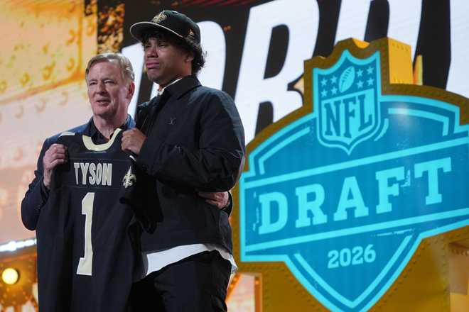 Arizona State wide receiver Jordyn Tyson cries while standing with NFL Commissioner Roger Goodell after being chosen by the New Orleans Saints with the eighth overall pick during the first round of the NFL football draft, Thursday, April 23, 2026, in Pittsburgh.