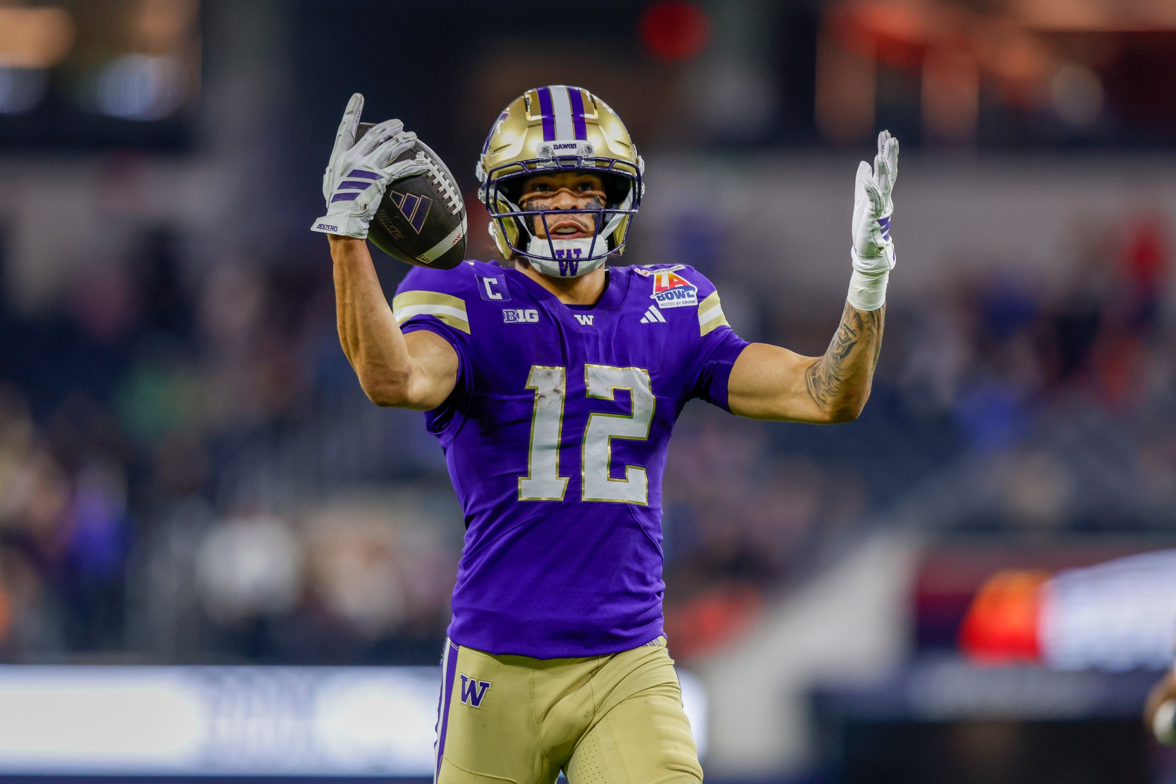 INGLEWOOD, CA - DECEMBER 13: Washington Huskies wide receiver Denzel Boston (12) catches the ball for a touchdown during the LA Bowl hosted by Gronk between the Boise State Broncos and the Washington Huskies on December 13, 2025, at SoFi Stadium in Inglewood, CA. (Photo by Jordon Kelly/Icon Sportswire via Getty Images)