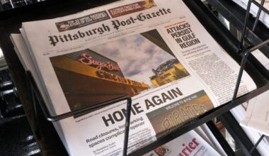 Photo of the front page of the Pittsburg Post-Gazette newspaper. The headline reads "HOME AGAIN"