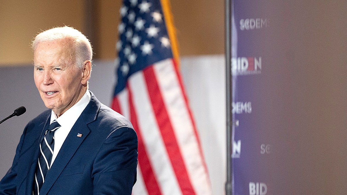 Former President Joe Biden speaking at a podium during a fundraising event in Columbia, South Carolina