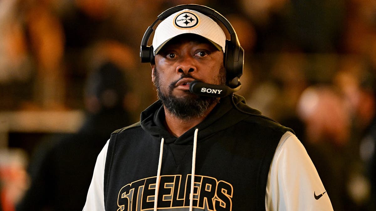 Pittsburgh Steelers head coach Mike Tomlin standing on the sidelines at Acrisure Stadium