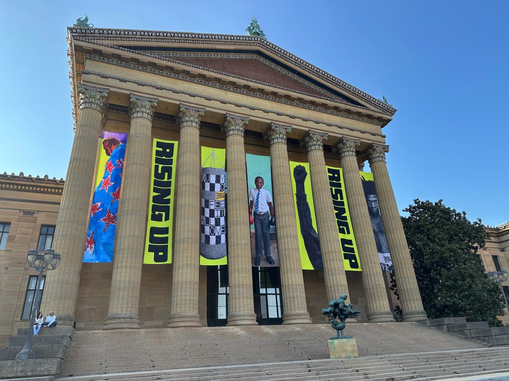 Banners for the "Rising Up: Rocky" exhibition hanging outside the Philadelphia Museum of Art.