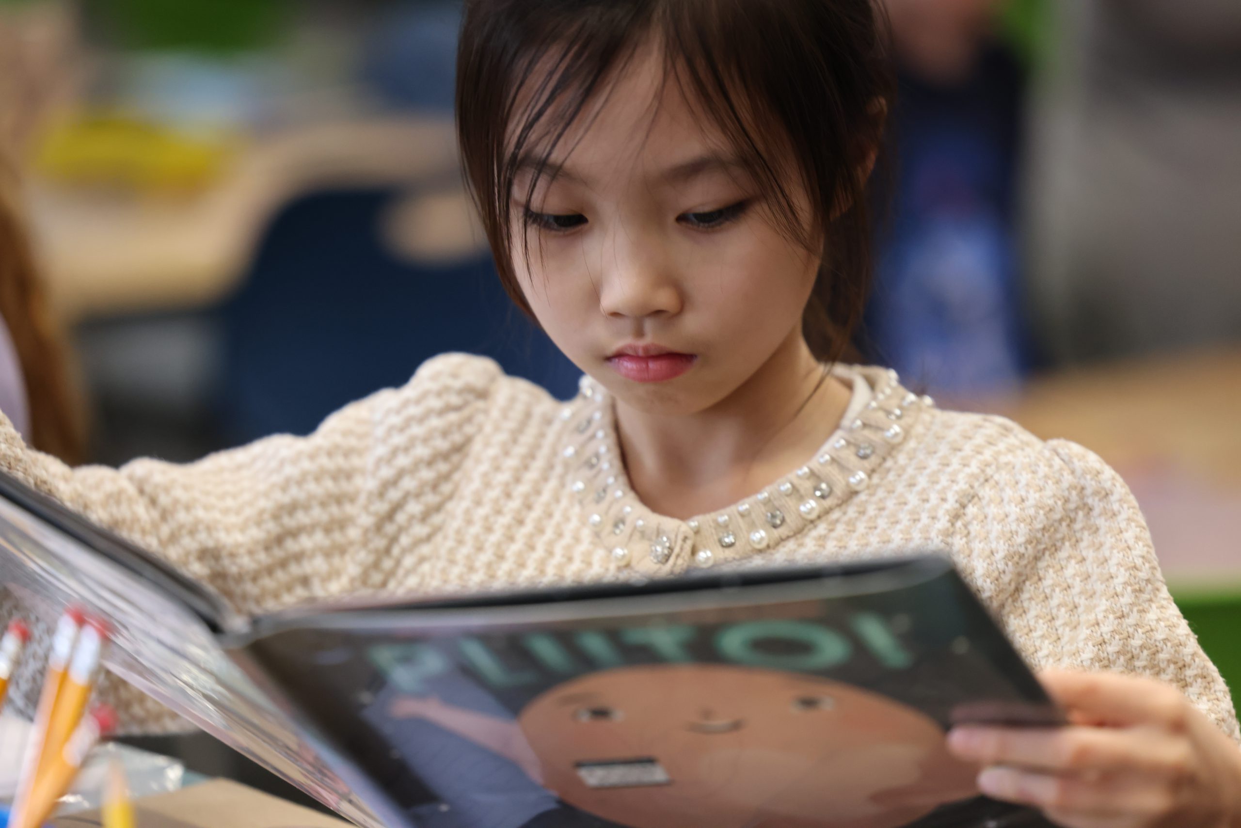 one student reads quietly