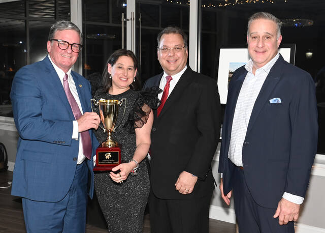 <p>State Secretary of Transportation Michael Carroll, left, received the Titan of Industry Award from the Greater Pittston Chamber of Commerce on Thursday, at The Banks - A Waterfront Venue. From left: Carroll; Michelle Mikitish, chamber president; Atty. Girard Mecadon, chamber board chair; and City of Pittston Mayor Michael Lombardo, event master of ceremonies.</p>
<p>Tony Callaio | For Sunday Dispatch</p>