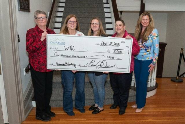 <p>Peg Ruddy, CEO of WRC; Nancy Perri, grants and education program director for WRC; Mackenzie Major of WRC; Tessa Wright, economic and housing program director for WRC; and Laura Ducceschi, president and CEO of Scranton Area Community Foundation, hold the check to WRC.</p>
<p>Submitted photo</p>