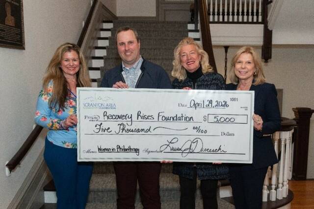 <p>Laura Ducceschi, president and CEO of Scranton Area Community Foundation; Brendan McGovern, executive director of Recovery Rises Foundation; Helen Lavelle, Board Chair of Recovery Rises Foundation; and Patti Thomas, Scranton Area Community Foundation Board Governor and WIP supporter, hold the check to Recovery Rises Foundation.</p>
<p>Submitted photo</p>