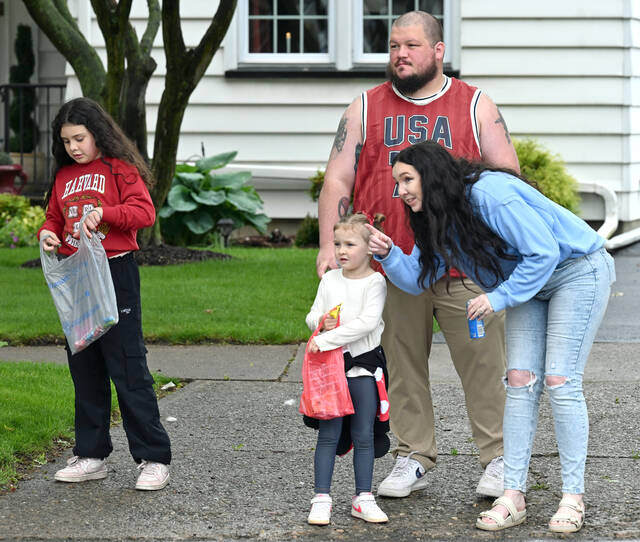 <p>The Gregorio family came prepared, bags in all, to get the tossed candy on Wyoming Ave., Wyoming, for the Memorial Day Parade. From left: Talia; Mia; dad, Dixon; and mom, Karyass.</p>
<p>Tony Callaio | For Sunday Dispatch</p>