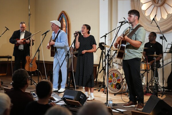 Conrad Fisher, Rose Stoltzfus and Ben Stoltzfus perform at Ragamuffin Hall in McCoysville, Pa., Saturday, April 25, 2026. (AP Photo/Matt Rourke)