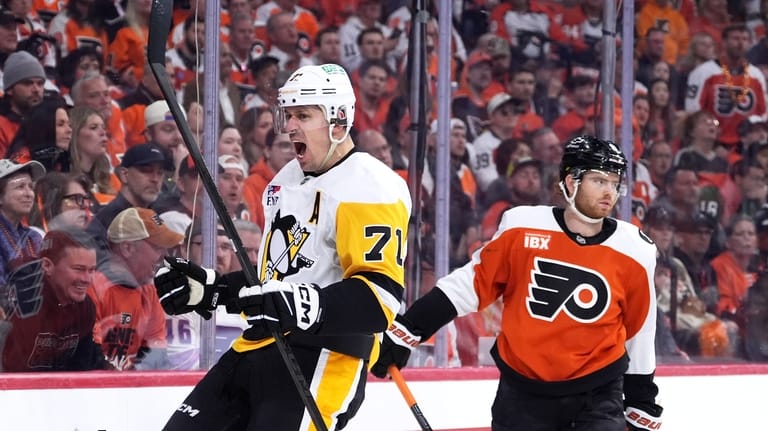 Pittsburgh Penguins' Evgeni Malkin, left, reacts past Philadelphia Flyers' Cam...