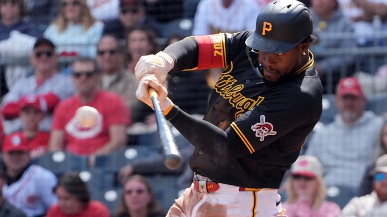Pittsburgh Pirates' Oneil Cruz drives in a run with a...