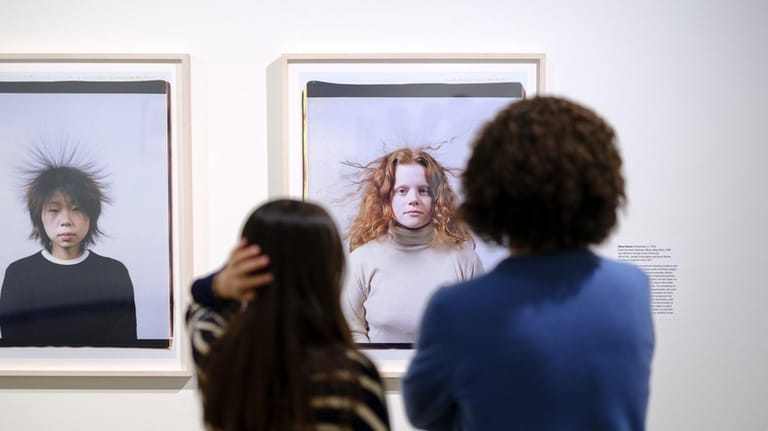 Visitors at The George Eastman Museum look at some works...