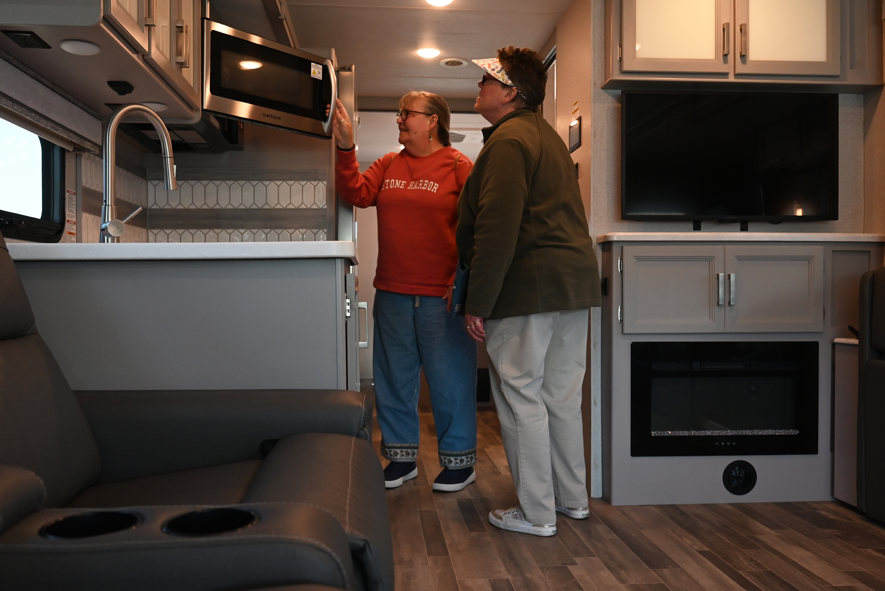 Janice Neagle, left, and Dianne Morrison, right, check out the...