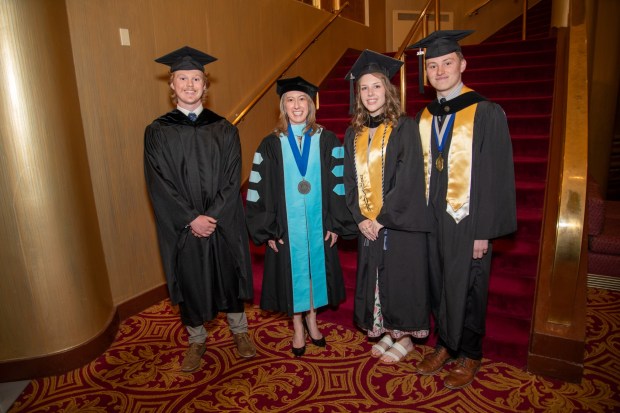 Johnson College celebrated its largest graduating class during its 107th Commencement Ceremony at the F.M. Kirby Center for the Performing Arts in Wilkes-Barre on Thursday. Pictured left to right: Ethan Gardiner '25, a Johnson College alumnus and maintenance technician specializing in automated equipment and controls at Lineage; Dr. Katie Pittelli, President and CEO of Johnson College; Hanaa Gohsler, Class of 2026 aalutatorian and Architectural Drafting & Design Technology graduate; and Jake Ryan, Class of 2026 valedictorian and Architectural Drafting & Design Technology graduate.