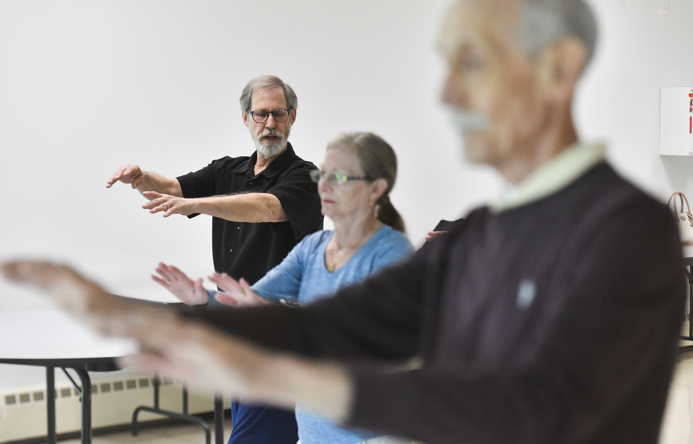 Instructor Rick Schmoyer teaches a Tai Chi class at the...