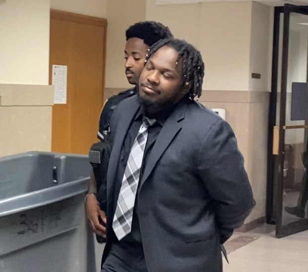 Jonathan Dell is escorted by a deputy sheriff from a Montgomery County courtroom after a jury convicted him of carrying out a home invasion robbery in Abington. (Photo by Carl Hessler Jr. - MediaNews Group)