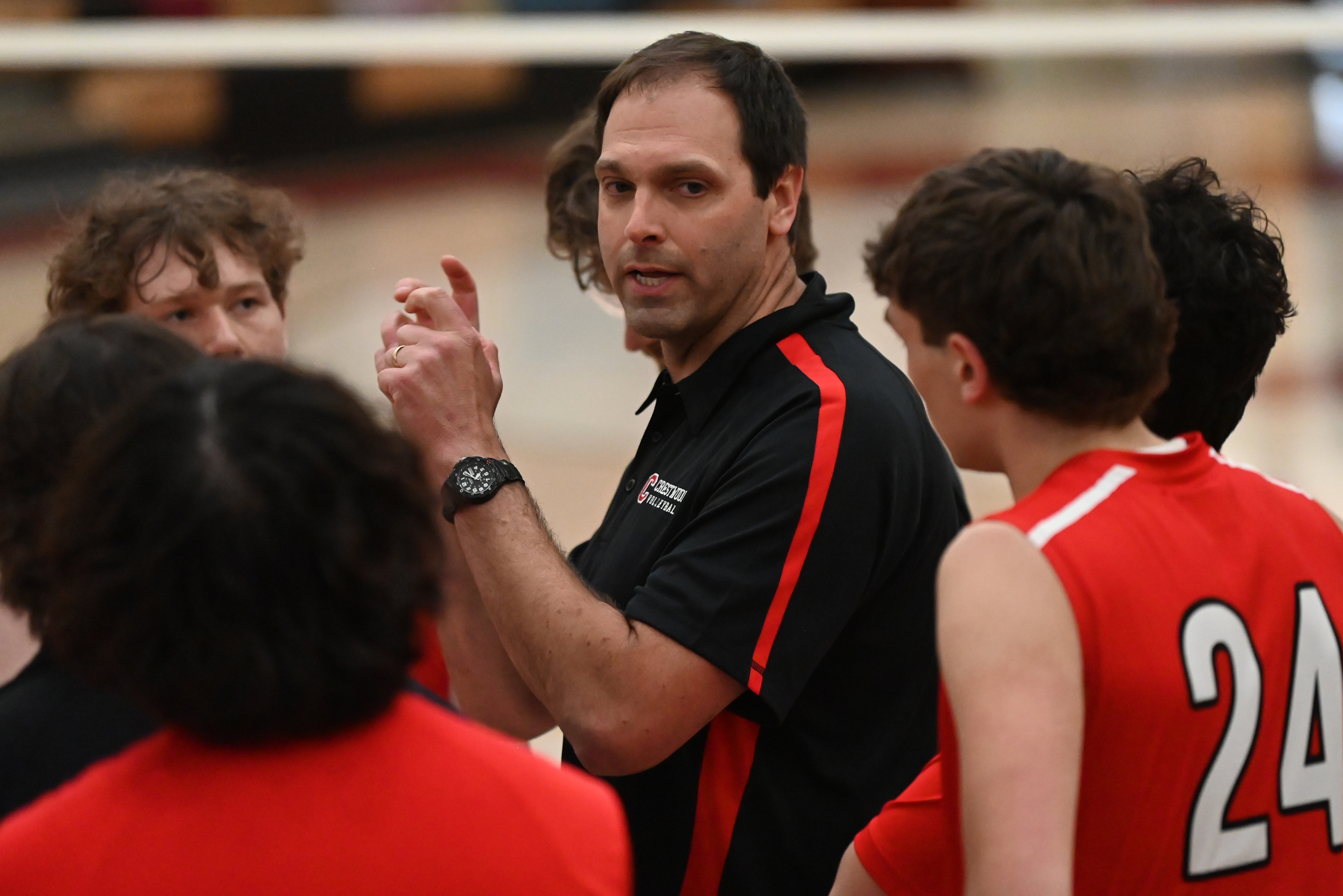 Crestwood’s head coach Jeff Stec talks to his players during...