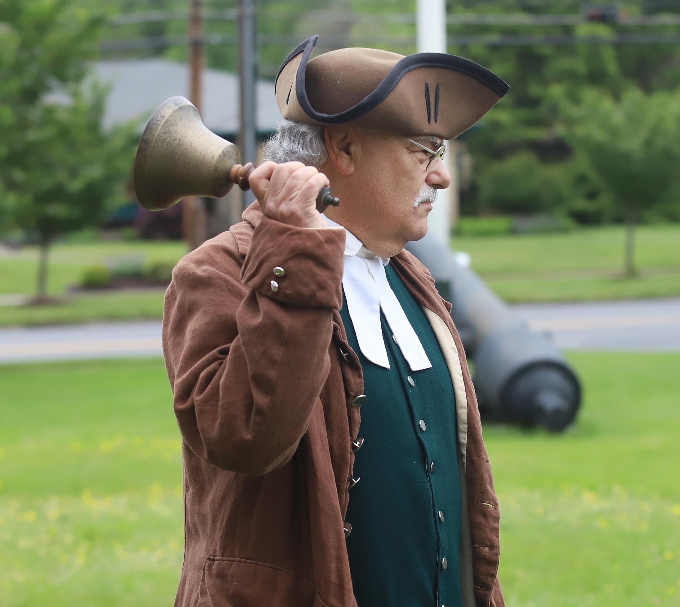 Renactor Mark Kahn portraying Josiah Entwhistle rings a bell to...
