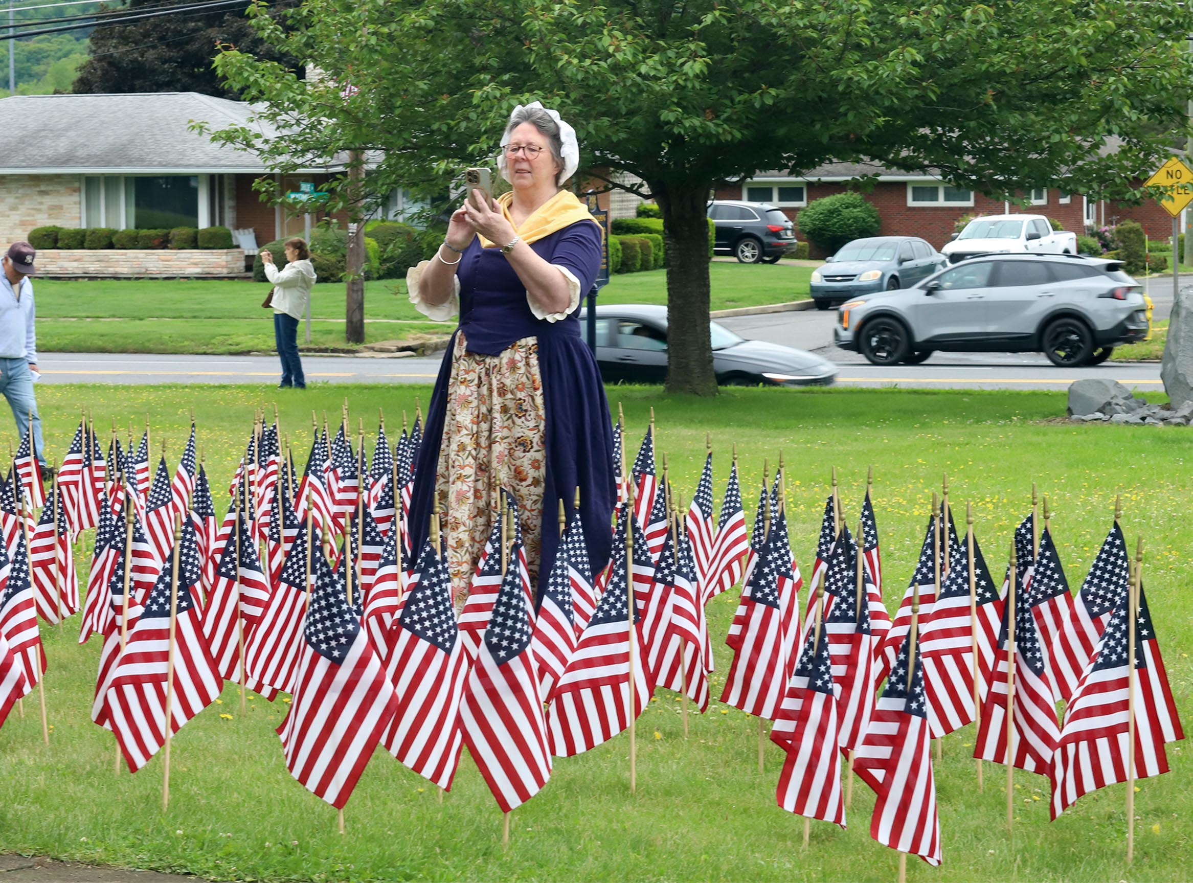 Reenator Nancy Walker takes a cell phone picture during a...