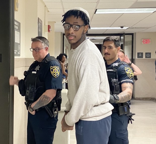 Jalen Douglas-Smith is escorted by sheriff's deputies from a Montogmery County courtroom after he testified against his co-conspirator charged in Abington gunpoint home invasion. (Photo by Carl Hessler Jr. - MediaNews Group)