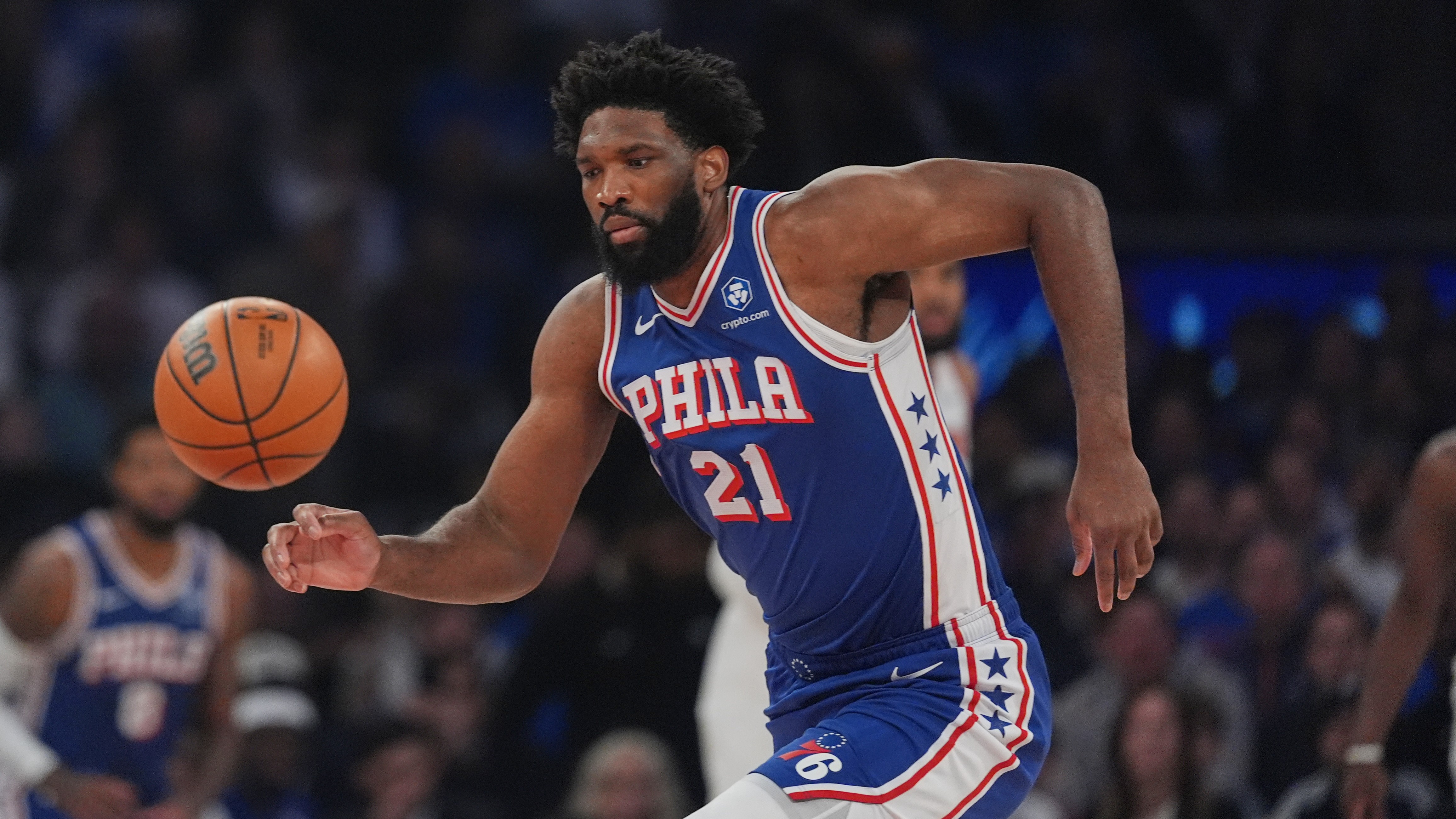 Philadelphia 76ers' Joel Embiid chases a loose ball during the first half of Game 1 in a second-round NBA basketball playoffs series against the New York Knicks