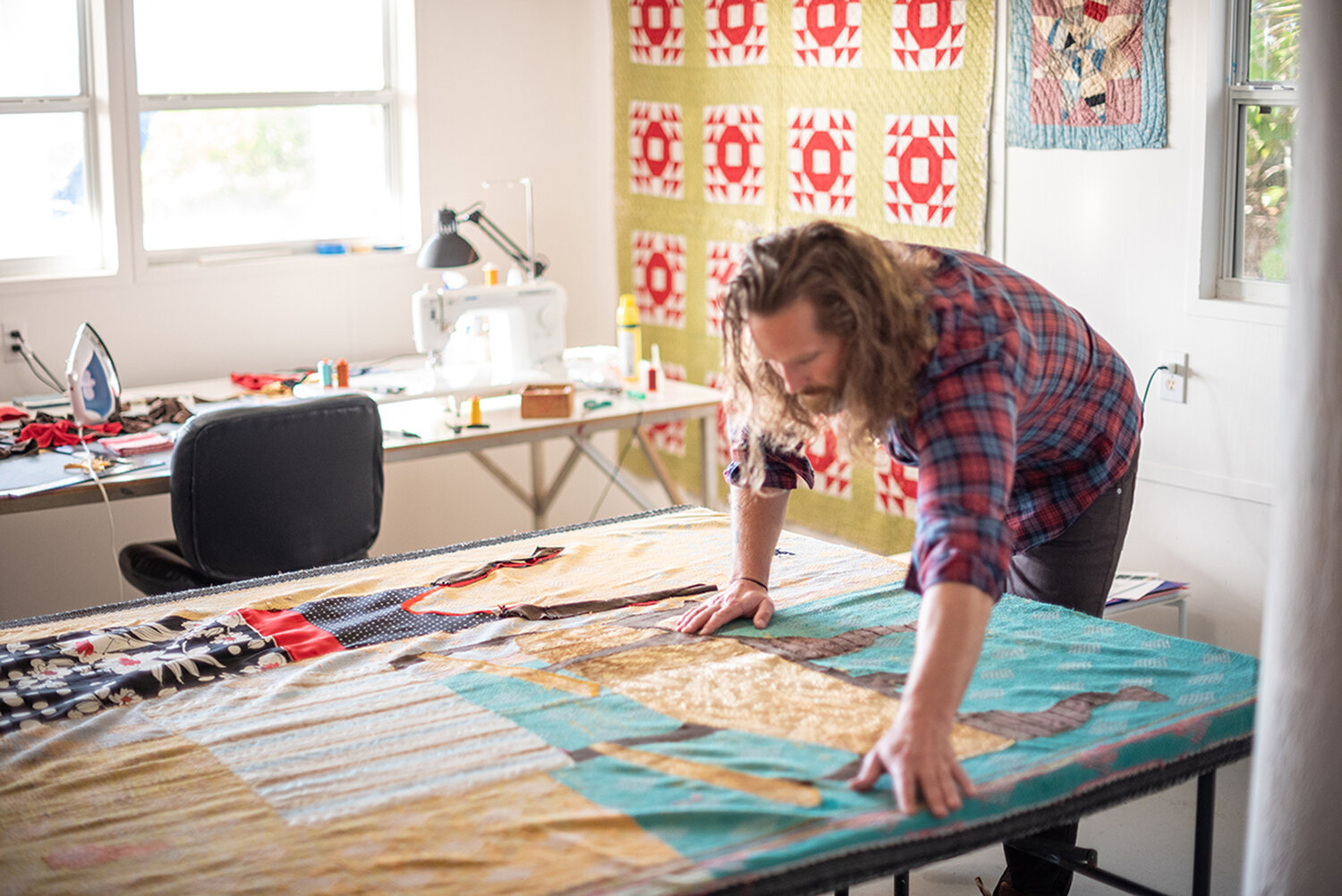 Jesse Krimes is shown at work in his studio.