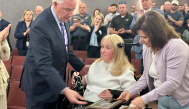 Bernadette Gaudio accepts an award posthumously granted to her son Andrew from Montgomery County District Attorney Kevin Steele.