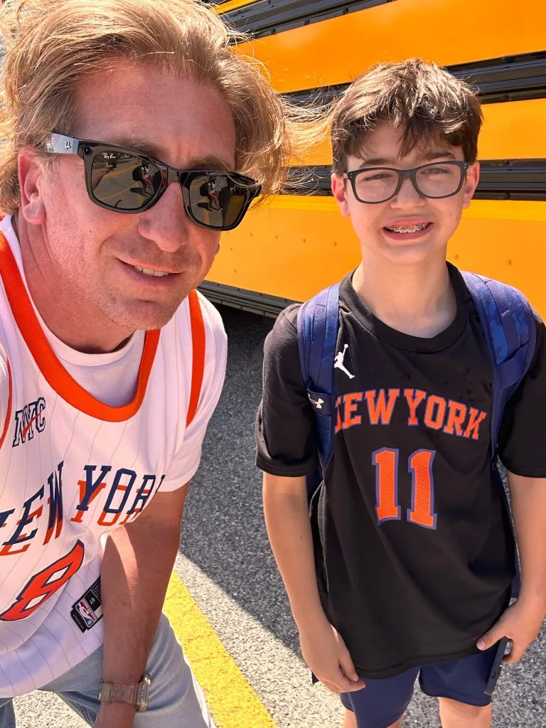 Nesaquake Middle School principal Daniel McCade wears Knicks gear with a student. Obtained by NYPost