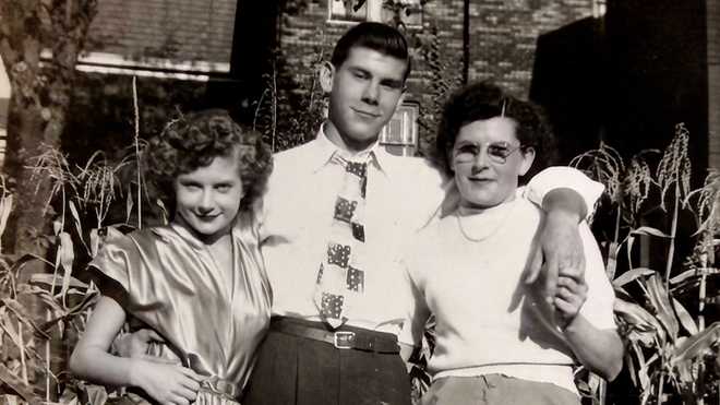 Army Cpl. Charles Carroll Jr. Army Cpl. Charles Carroll Jr. with his mother, Louise (right), and sister, Valerie (left)
