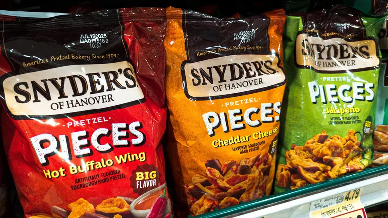 Bags of Snyder's of Hanover pretzels on a store shelf