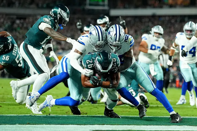PHILADELPHIA, PENNSYLVANIA - SEPTEMBER 04: Saquon Barkley #26 of the Philadelphia Eagles scores a 10 yard touchdown against the Dallas Cowboys during the second quarter in the game at Lincoln Financial Field on September 04, 2025 in Philadelphia, Pennsylvania. (Photo by Mitchell Leff/Getty Images)