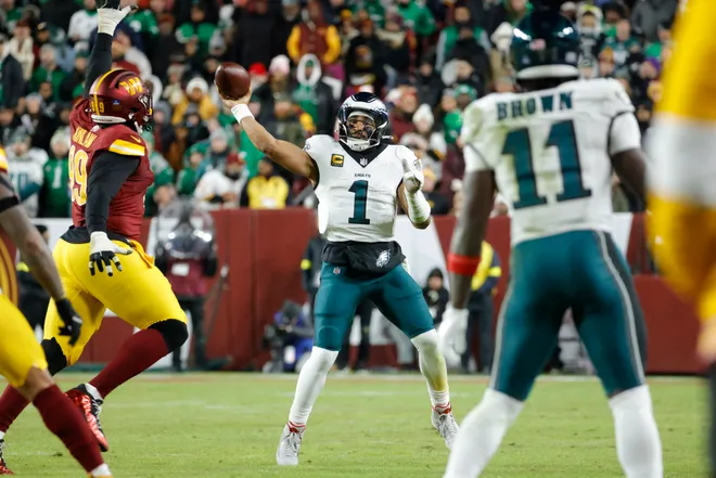 Dec 20, 2025; Landover, Maryland, USA; Philadelphia Eagles quarterback Jalen Hurts (1) throws the ball to Philadelphia Eagles wide receiver A.J. Brown (11) against the Washington Commanders during the second half at Northwest Stadium. Mandatory Credit: Amber Searls-Imagn Images