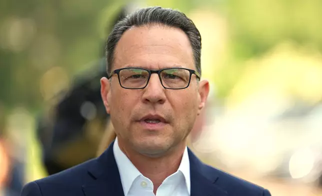 Pennsylvania Gov. Josh Shapiro speaks with members of the media outside his polling place in Rydal, Pa., Tuesday, May 19, 2026. (AP Photo/Matt Rourke)
