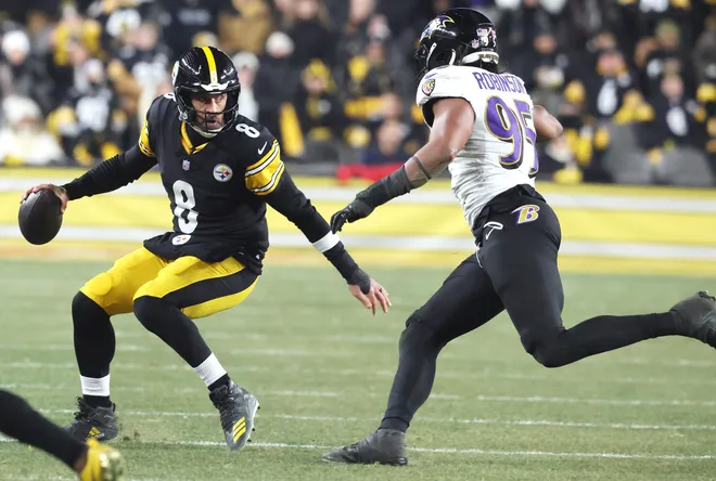 Jan 4, 2026; Pittsburgh, Pennsylvania, USA; Pittsburgh Steelers quarterback Aaron Rodgers (8) avoids the sack by Baltimore Ravens linebacker Tavius Robinson (95) during the first half at Acrisure Stadium. Mandatory Credit: Charles LeClaire-Imagn Images