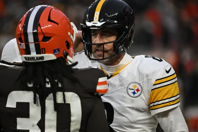 Dec 28, 2025; Cleveland, Ohio, USA; Pittsburgh Steelers quarterback Aaron Rodgers (8) exchanges words with Cleveland Browns linebacker Devin Bush (30) after the game at Huntington Bank Field. Mandatory Credit: Ken Blaze-Imagn Images