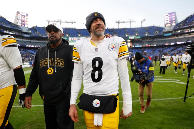 Dec 7, 2025; Baltimore, Maryland, USA; Pittsburgh Steelers head coach Mike Tomlin and quarterback Aaron Rodgers (8) walk off the field after the game against the Baltimore Ravens at M&T Bank Stadium. Mandatory Credit: Peter Casey-Imagn Images