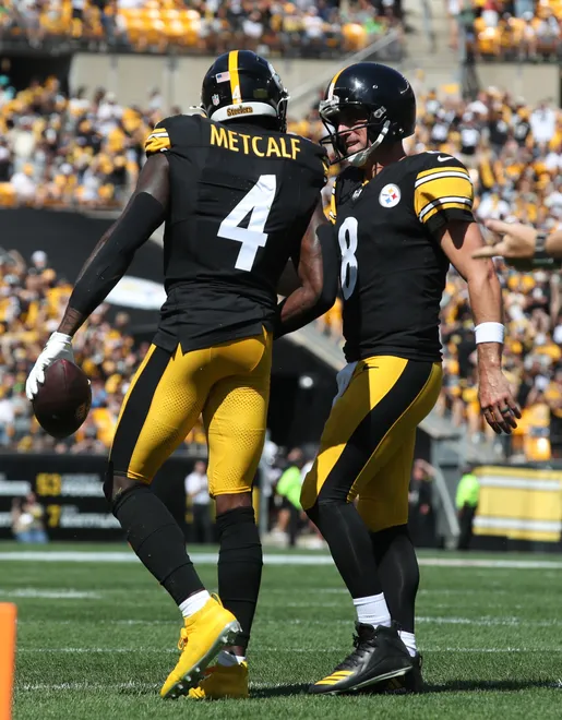 Sep 14, 2025; Pittsburgh, Pennsylvania, USA; Pittsburgh Steelers wide receiver DK Metcalf (4) and quarterback Aaron Rodgers (8) celebrate after combining for a touchdown against the Seattle Seahawks during the second quarter at Acrisure Stadium. Mandatory Credit: Charles LeClaire-Imagn Images